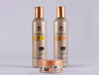Trio de produtos KeraCare Intensive Restorative para fortalecimento capilar, incluindo shampoo (240ml), condicionador (240ml) e máscara (180g), dispostos lado a lado em embalagens elegantes, voltados para cabelos fragilizados.