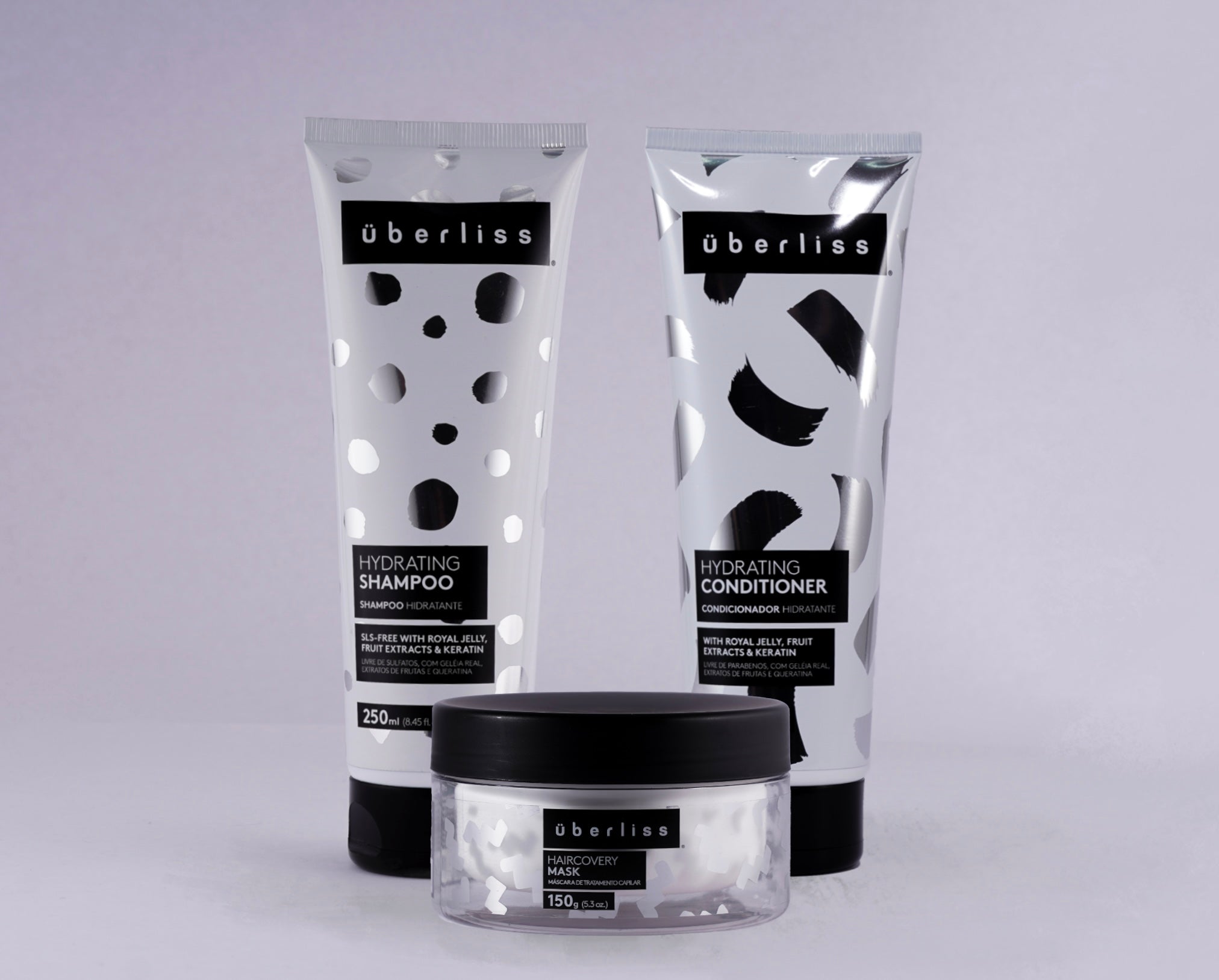 &quot;Kit capilar com três produtos Überliss: shampoo e condicionador hidratantes de 250ml e máscara Haircovery de 150g. Fórmulas nutritivas com geleia real, extratos de maçã, limão, cana-de-açúcar, queratina e chá verde. Promovem hidratação, fortalecimento, brilho e maciez para todos os tipos de cabelo